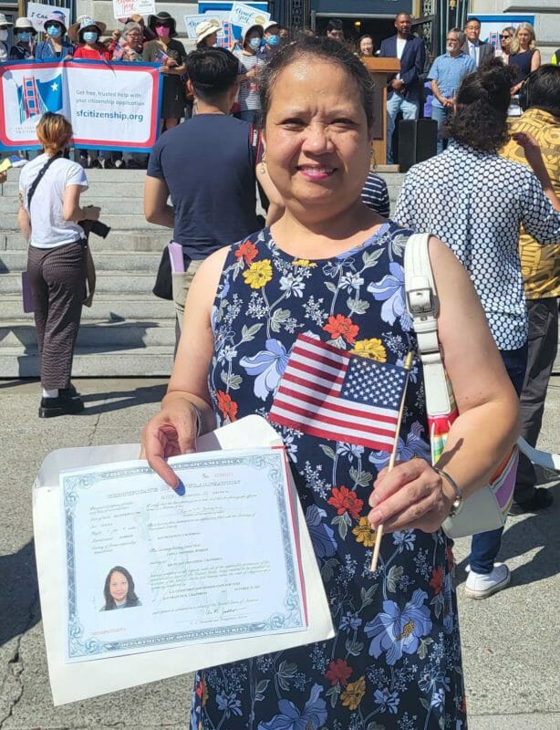 Chona Mendoza Bussani proudly shows her naturalization papers that she really dreamt of getting as a typical simple Filipina from Batangas. INQUIRER/Jun Nucum  