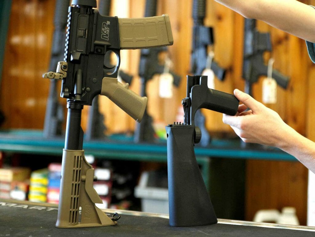 A bump fire stock, (R), that attaches to a semi-automatic rifle to increase the firing rate is seen at Good Guys Gun Shop in Orem, Utah, U.S., October 4, 2017. REUTERS/George Frey/File Photo