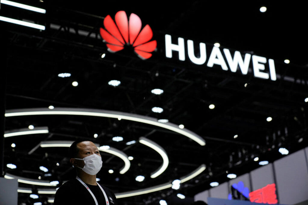  A person stands by a sign of Huawei during World Artificial Intelligence Conference, following the coronavirus disease (COVID-19) outbreak, in Shanghai, China, September 1, 2022. REUTERS/Aly Song