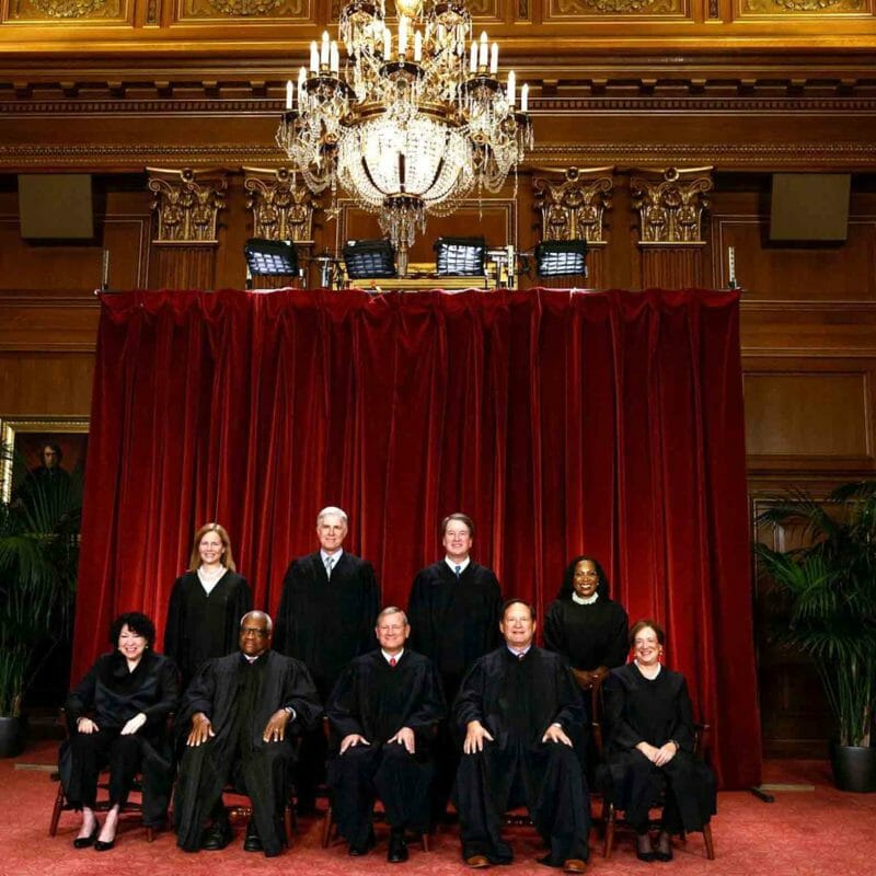 U.S. Supreme Court justices Amy Coney Barrett, Neil M. Gorsuch, Brett M. Kavanaugh, Ketanji Brown Jackson, Sonia Sotomayor, Clarence Thomas, Chief Justice John G. Roberts, Jr., Samuel A. Alito, Jr. and Elena Kagan pose for their group portrait at the Supreme Court in Washington, U.S., October 7, 2022. REUTERS/Evelyn Hockstein/File Photo