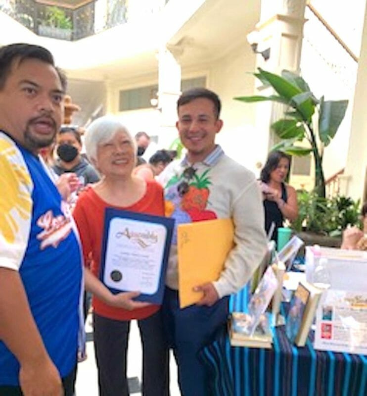 Jun Aglipay (left) and Mark Fuentes of the 64th Assembly district present Award of Recognition to Linda Nietes-Little. INQUIRER/Cecile Ochoa