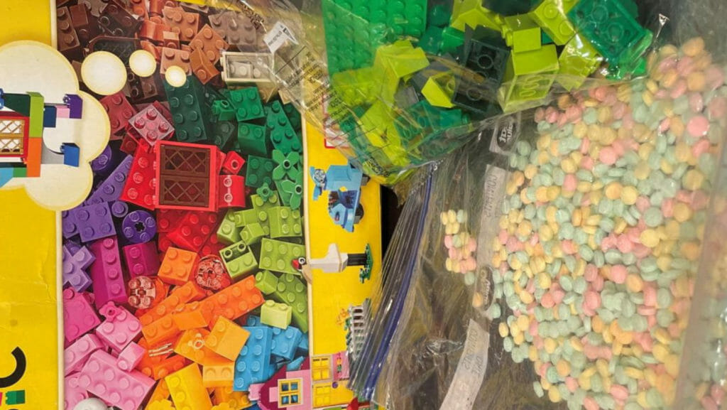 Colorful fentanyl pills. US fentanyl seized in Lego box pointing to Mexican cartels
