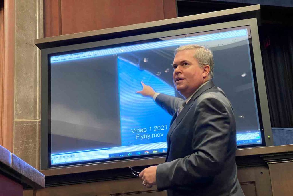 Deputy Director of U.S. Naval Intelligence Scott Bray points to a video of a 'flyby' as he testifies before a House Intelligence Counterterrorism, Counterintelligence, and Counterproliferation Subcommittee hearing about "Unidentified Aerial Phenomena," in the first open congressional hearing on 'UFOs' in more than half-century, on Capitol Hill in Washington, U.S., May 17, 2022. REUTERS/Joey Roulette/File Photo