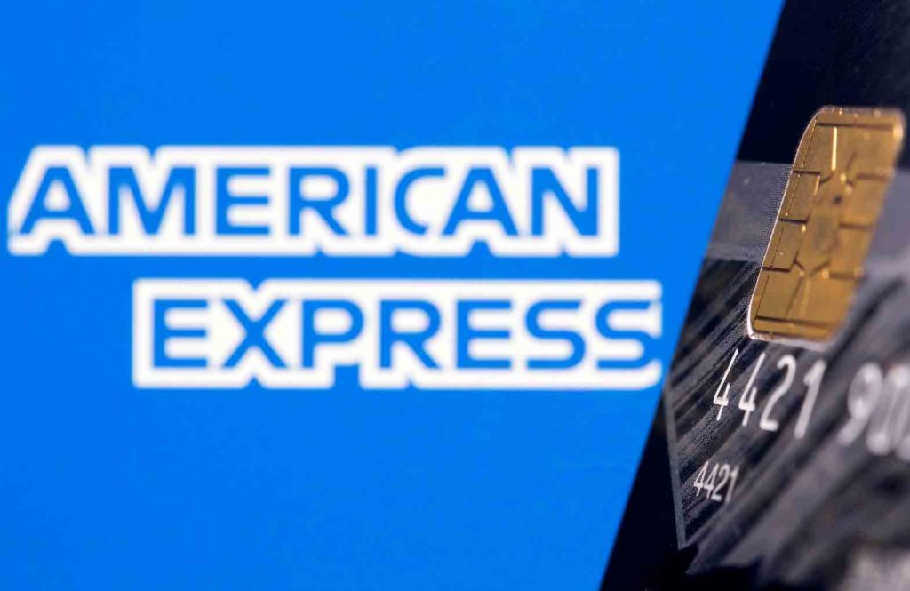 Credit card is seen in front of displayed American Express logo in this illustration taken, July 15, 2021. REUTERS/Dado Ruvic/Illustration