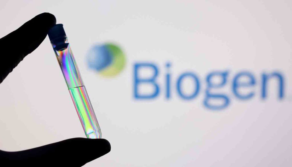 A test tube is seen in front of displayed Biogen logo in this illustration taken, December 1, 2021. REUTERS/Dado Ruvic/Illustration