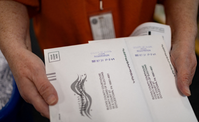"On Demand" absentee or mail-in ballots are time stamped after being filled out in Doylestown, Pennsylvania, U.S. October 31, 2022. REUTERS/Hannah Beier/File Photo