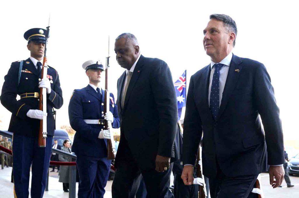 U.S. Defense Secretary Lloyd Austin escorts Australian Defense Minister Richard Marles into the Pentagon for their meeting in Washington, U.S., December 5, 2022. REUTERS/Kevin Lamarque/File Photo