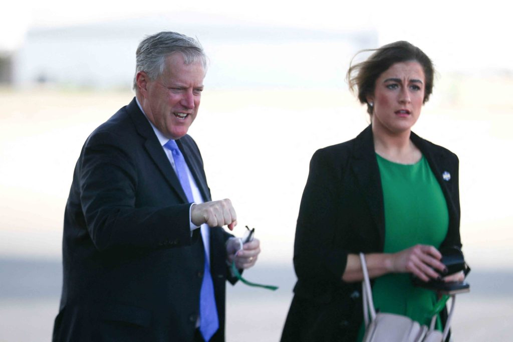 White House Chief of Staff Mark Meadows, left, walks with senior aide Cassidy Hutchinson before a campaign rally in Gastonia, North Carolina, U.S. October 22, 2020. REUTERS/Tom Brenner