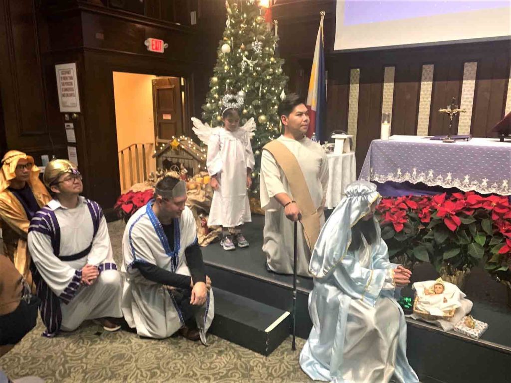 “Panunuluyan” a Bethlehem manger scene reenacted by JCI  New York during the mass. INQUIRER/C. Tanjutco