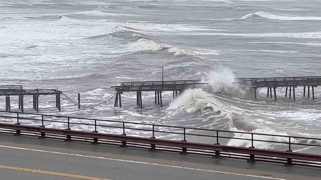 Capitola Wharf damaged by heavy storm waves is seen in Santa Cruz, California, U.S., January 5, 2023, in this screen grab obtained from a social media video. Kelly Pound/via REUTERS