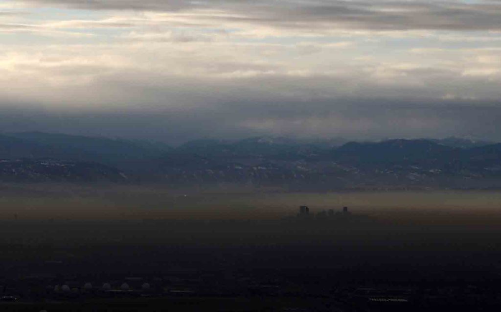 The Rocky Mountains are pictured as a layer of air pollution hangs over Denver, Colorado, U.S. January 21, 2020. Picture taken January 21, 2020. REUTERS/Jim Urquhart/File Photo