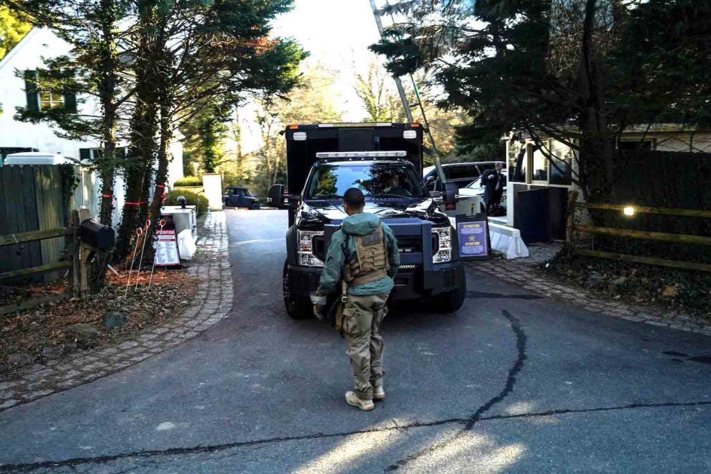 Secret Service personnel park vehicles in the driveway leading to U.S. President Joe Biden's house after classified documents were reported found there by the White House in Wilmington, Delaware, U.S., January 15, 2023. REUTERS/Joshua Roberts