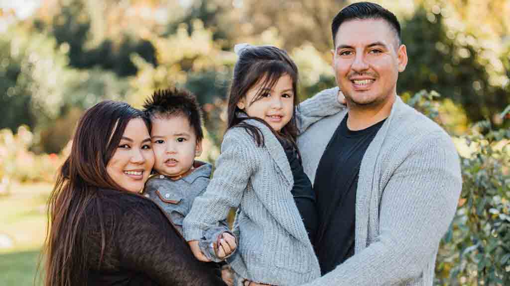 Priscilla and Jose Gamez with their two children. Priscilla is the daughter of Hmong immigrants, while Jose traces his roots to both Indigenous Mexican and German ancestry. Their story is among those told in the California Love Stories project. 