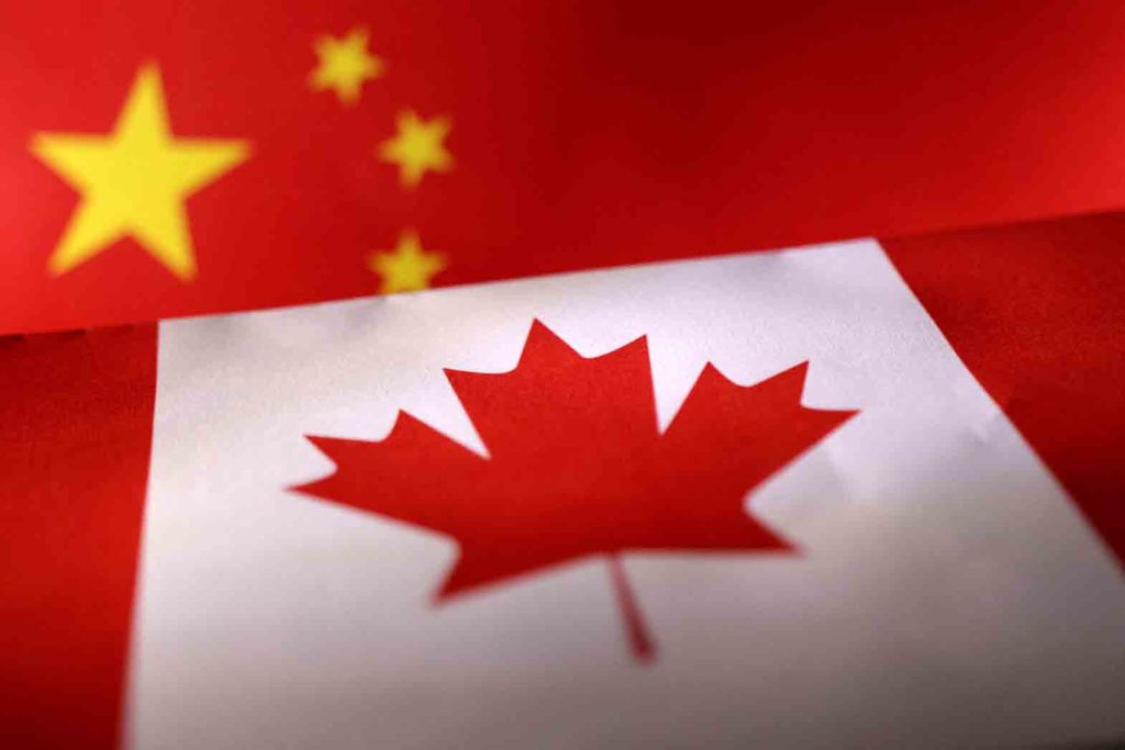 Printed Chinese and Canada flags are seen in this illustration, July 21, 2022. REUTERS/Dado Ruvic/Illustration/File Photo