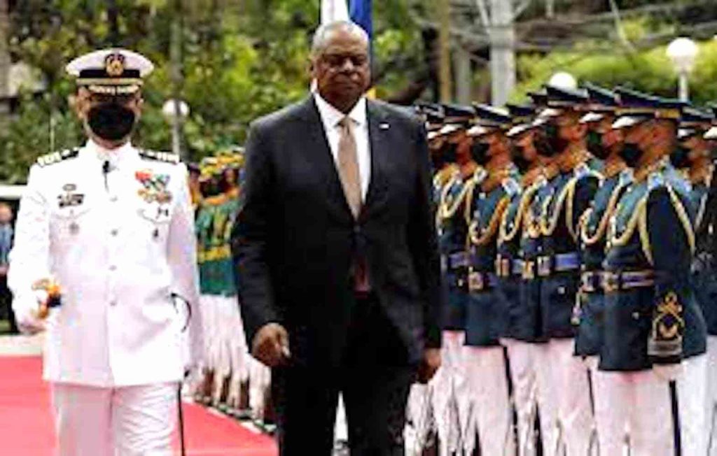 U.S. Defense Secretary Lloyd Austin III walks past military guards during arrival honors at the Department of National Defense in Camp Aguinaldo military camp in Quezon City, Metro Manila, Philippines, February 2, 2023. Rolex dela Pena/Pool via REUTERS