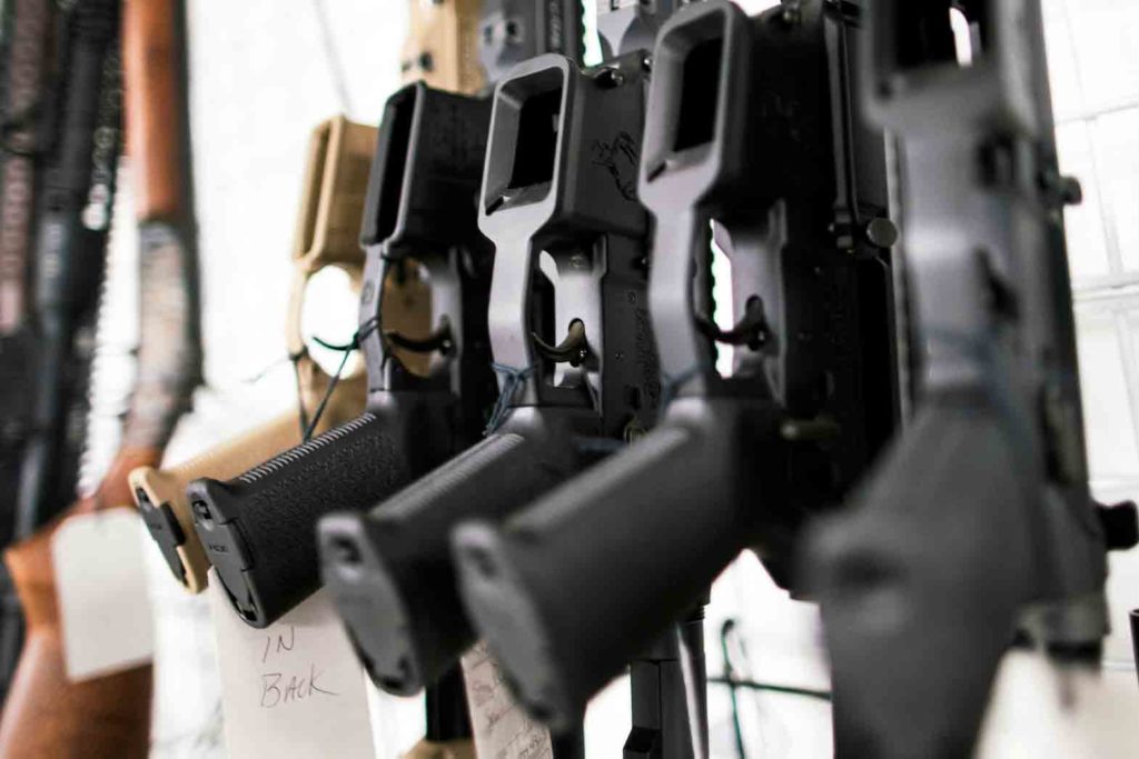 Guns are displayed at Shore Shot Pistol Range gun shop in Lakewood Township, New Jersey, U.S. March 19, 2020. REUTERS/Eduardo Munoz