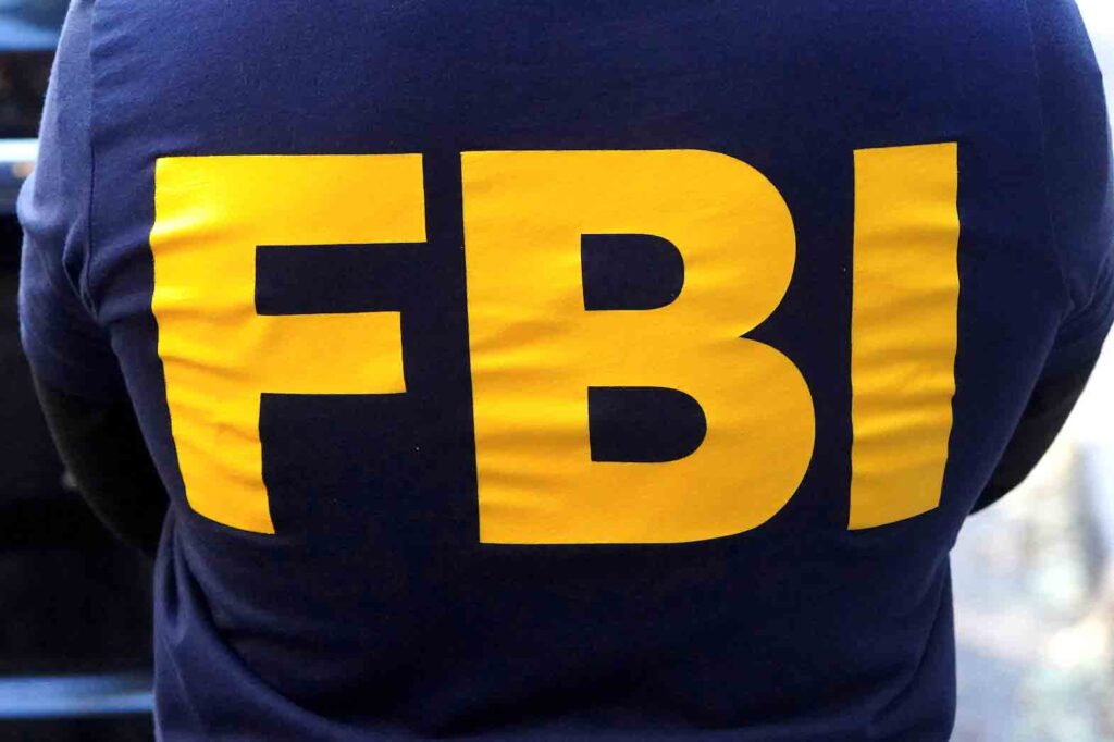 An FBI logo is pictured on an agent's shirt in the Manhattan borough of New York City, New York, U.S. October 19, 2021. REUTERS/Carlo Allegri