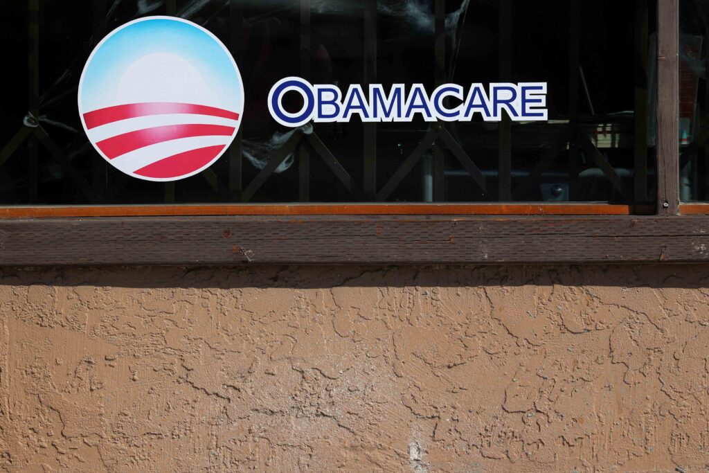A sign on an insurance store advertises Obamacare in San Ysidro, San Diego, California, U.S., October 26, 2017. REUTERS/Mike Blake 