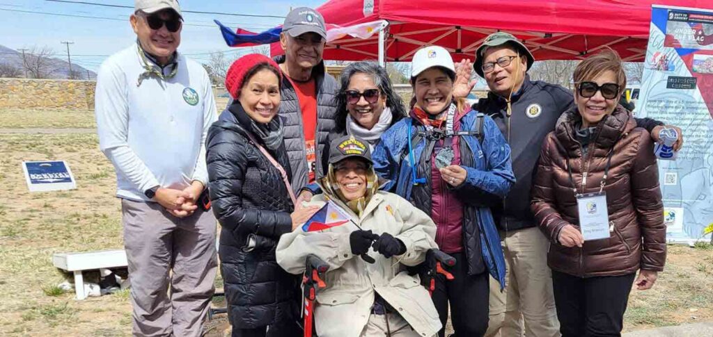Christy Poisot, third from right, is cheered on by the FilVetREP team, after completing her 14.2 mile marathon. Also in the picture are FilVetREP Chairman Retired Arny Maj. Gen. Antonio Taguba (third from left)) and World War II Veteran Remigio Cabacar (seated). (FilVetREP photo)
