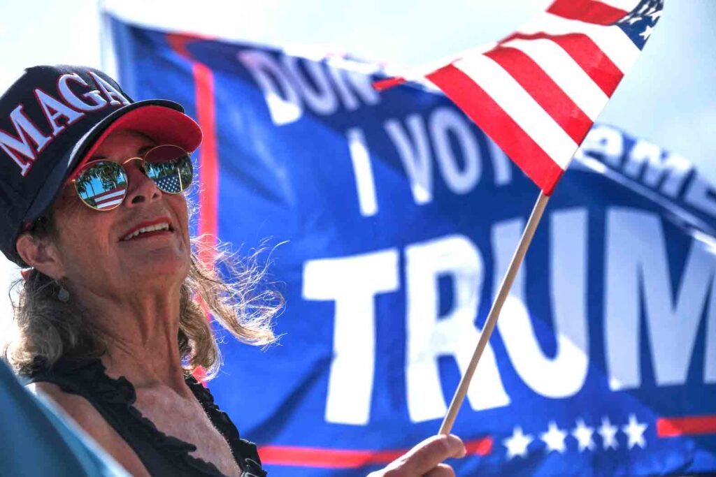 A supporter of former U.S. President Donald Trump outside his Mar-a-Lago resort after he was indicted by a Manhattan grand jury following a probe into hush money paid to porn star Stormy Daniels, in Palm Beach, Florida, U.S. April 2, 2023. REUTERS/Ricardo Arduengo