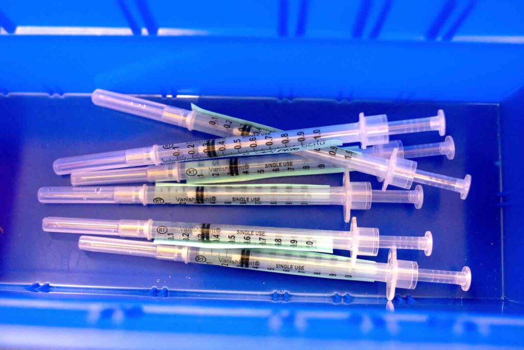 Syringes ready to be administrated to residents who are over 50 years old and immunocompromised and are eligible to receive their second booster shots of the coronavirus disease (COVID-19) vaccines are seen in Waterford, Michigan, U.S., April 8, 2022. REUTERS/Emily Elconin