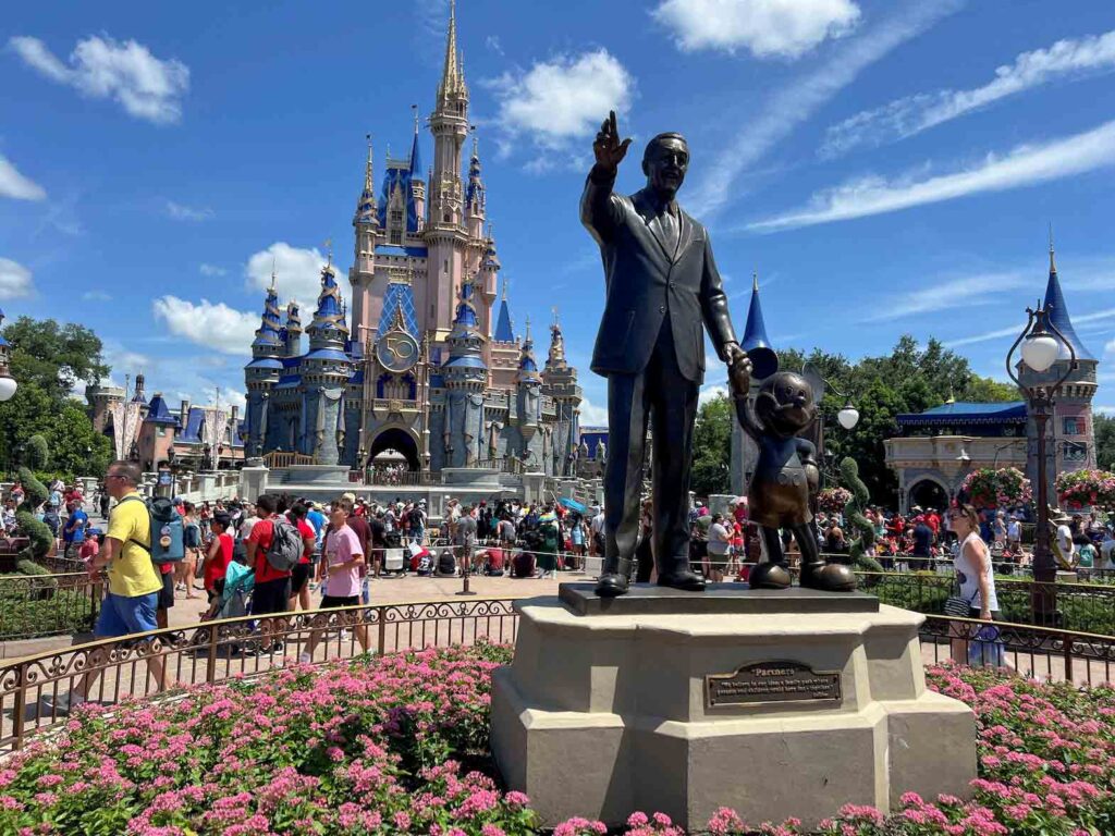 People gather at the Magic Kingdom theme park before the "Festival of Fantasy" parade at Walt Disney World in Orlando, Florida, U.S. July 30, 2022. REUTERS/Octavio Jones/File Photo