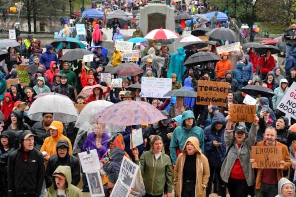 Hundreds of protesters gathered again outside the state house in the rain on Thursday and packed the gallery above the House floor, holding signs in favor of stricter gun control.