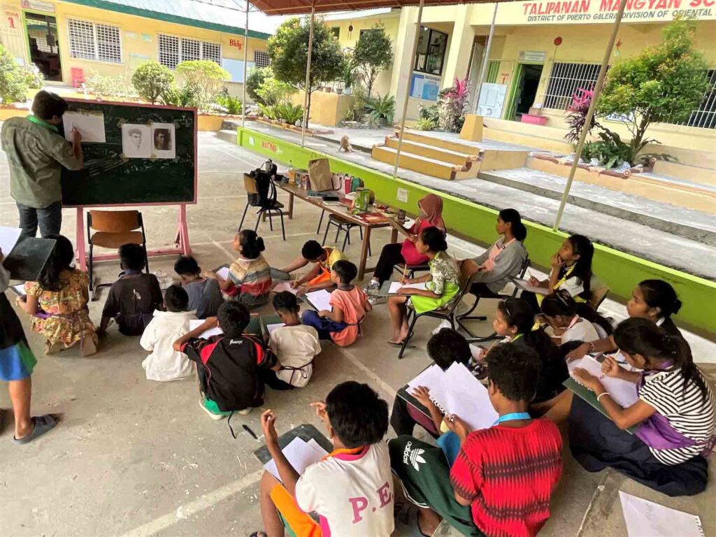Crispin Bobier, winner of EEC 500 Years of Christianity competition, gives basic drawing lessons to Talipanan Mangyan School children. CONTRIBUTED