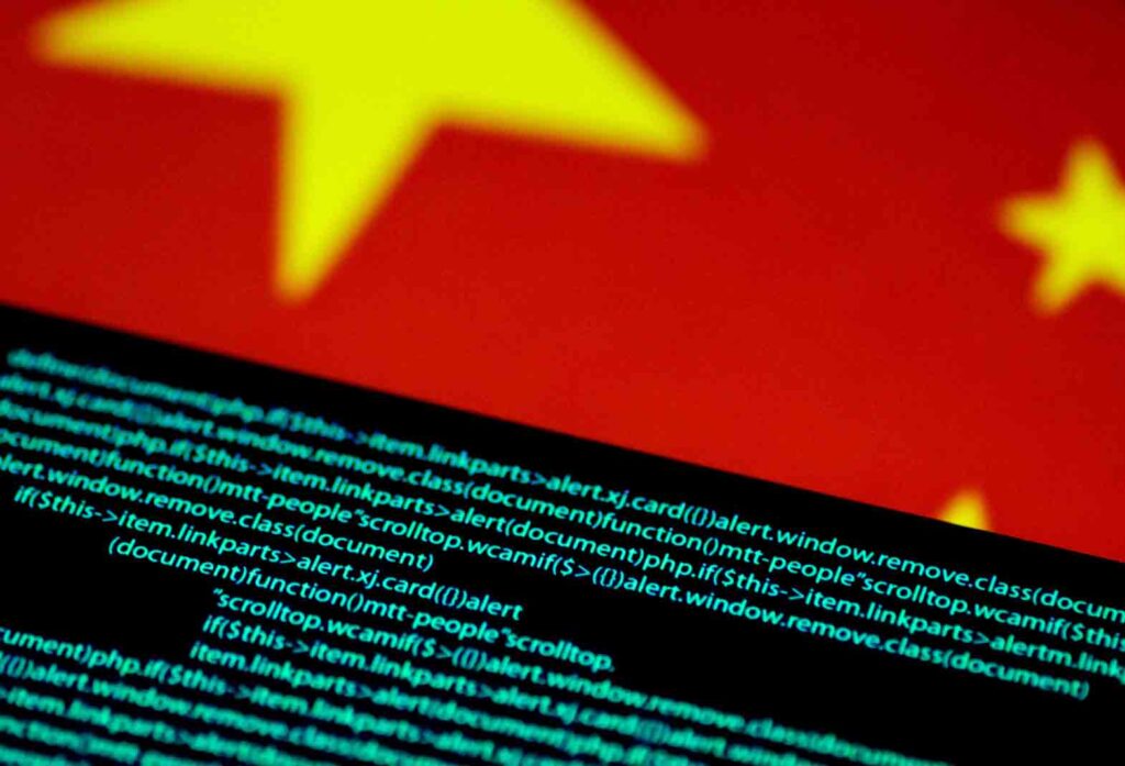 Computer code is seen on a screen above a Chinese flag in this July 12, 2017 illustration photo. REUTERS/Thomas White/Illustration