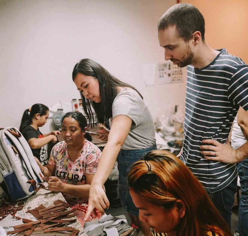Gelaine Santiago and husband Jérôme Gagnon-Voyer, co-founders of Cambio & Co., consulting with artisans in the Philippines. WEBSITE
