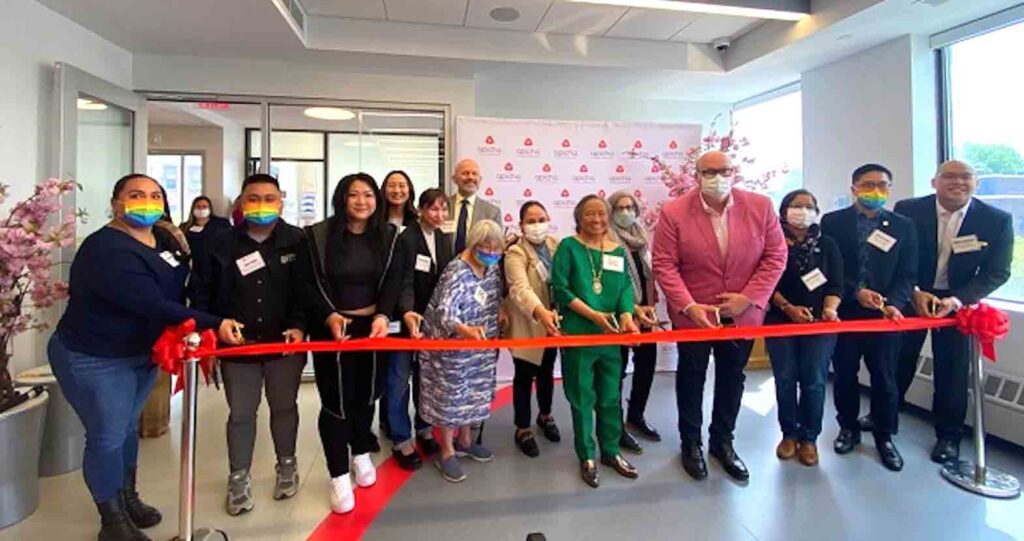 CEO Therese Rodriguez (in green suit) leads ribbon cutting ceremony to open Apicha CHC’s second health center in Jackson Heights, Queens: ‘We will serve anyone.’ CONTRIBUTED