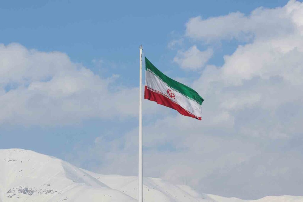 The Iranian flag is seen flying over a street in Tehran, Iran, February 1, 2023. Majid Asgaripour/WANA (West Asia News Agency) via REUTERS/File Photo