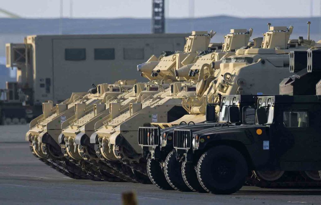 Bradley Fighting Vehicles of the U.S. army get offloaded from cargo vessel ARC Integrity, after their arrival at the harbor in Bremerhaven, Germany, February 10, 2023. REUTERS/Fabian Bimmer//File Photo
