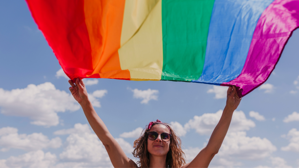 Image depicting Pride Month celebration with LGBTQ+ flag