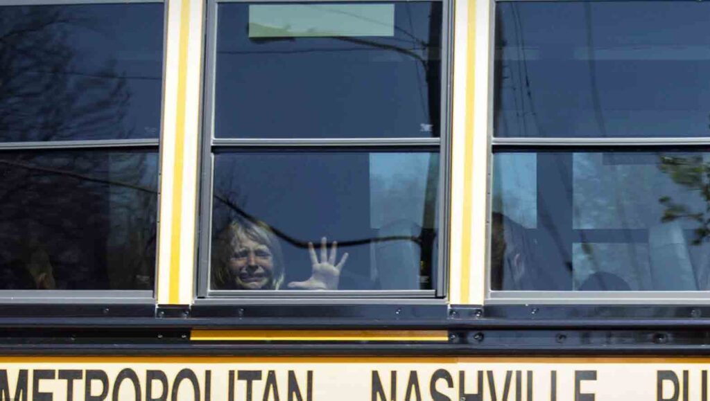 A child weeps while on the bus leaving The Covenant School following a mass shooting at the school in Nashville, Tenn., Monday, March23. A 28-year-old killed three children and three adults in a shooting at a small Christian elementary school before being killed by police. AP PHOTO