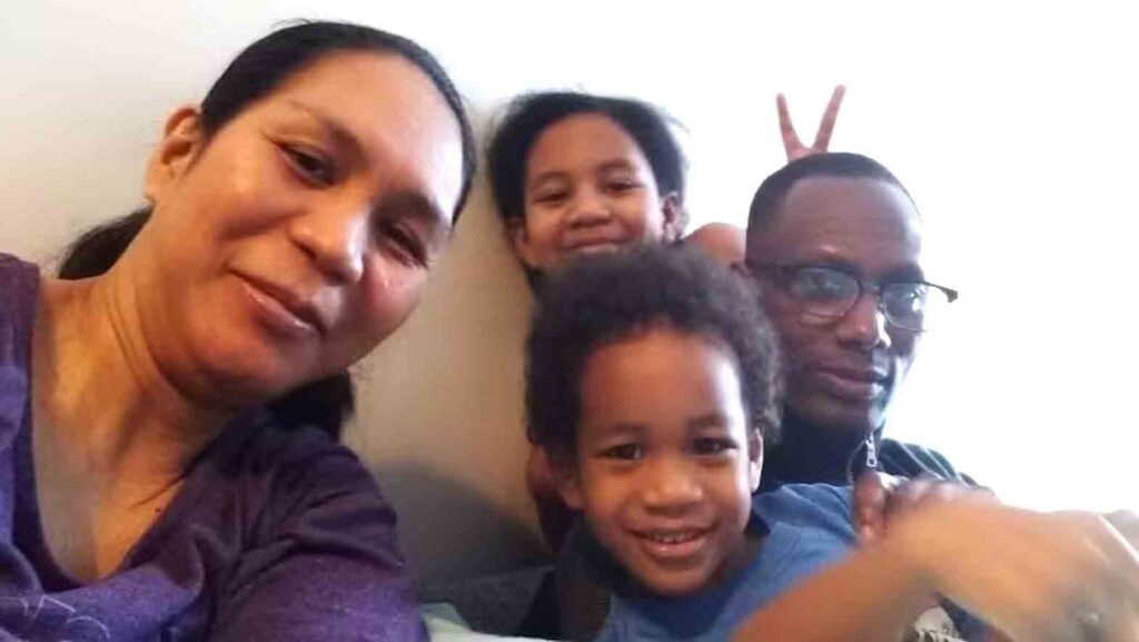 A Filipino-Nigerian family in happier times: David Ajibade, right, was deported to Nigeria on June 29. His wife Arlyn Huilar, left, has been given a little over a week to prove her youngest son Carlsen can be deported with her to the Philippines along with her two other children