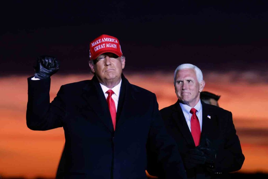 U.S. President Donald Trump and Vice President Mike Pence attend a campaign rally at Cherry Capital Airport in Traverse City, Michigan, U.S., November 2, 2020. REUTERS/Carlos Barria/File Photo