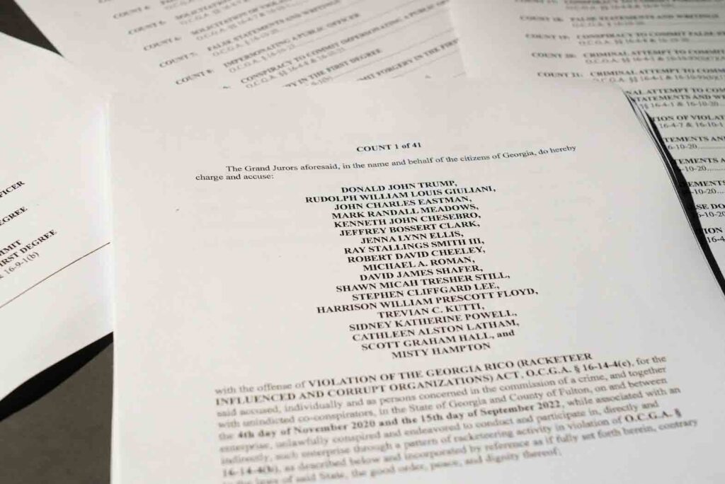 A view of the indictment, after a Georgia grand jury voted to indict former president Donald Trump with several felonies late Monday night in the case investigating attempts to overturn the results of the 2020 presidential election, is pictured at the Reuters Washington office, D.C., U.S. August 14, 2023. REUTERS/Julio-Cesar Chavez