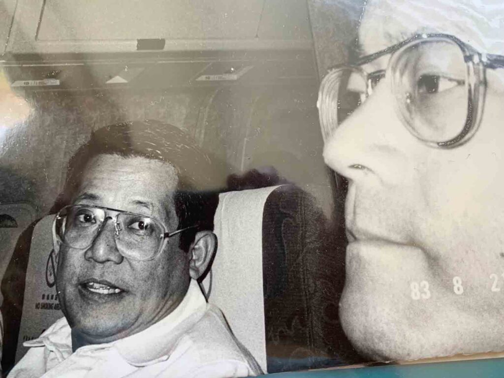 Ninoy Aquino chatting with brother-in-law Ken Kashiwahara on their fateful flighto to Manila. CONTRIBUTED