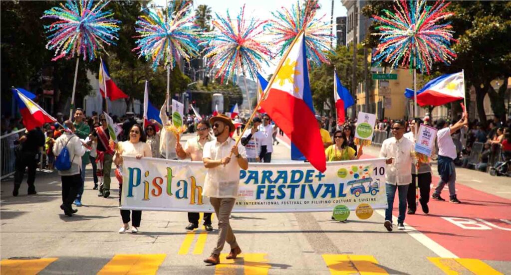 Pistahan Parade with banners and flags. CONTRIBUTED