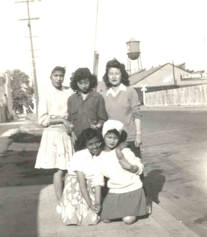 Filipinas pose near Pinoytown canneries in the 1940s. (Photo courtesy of the Bacosa Family)