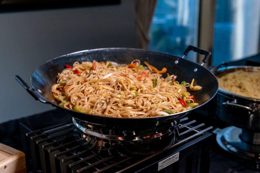 Korean noodles cooked in cast-iron wok