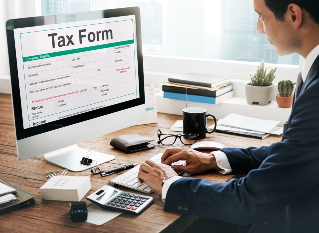 Man filling out tax form online