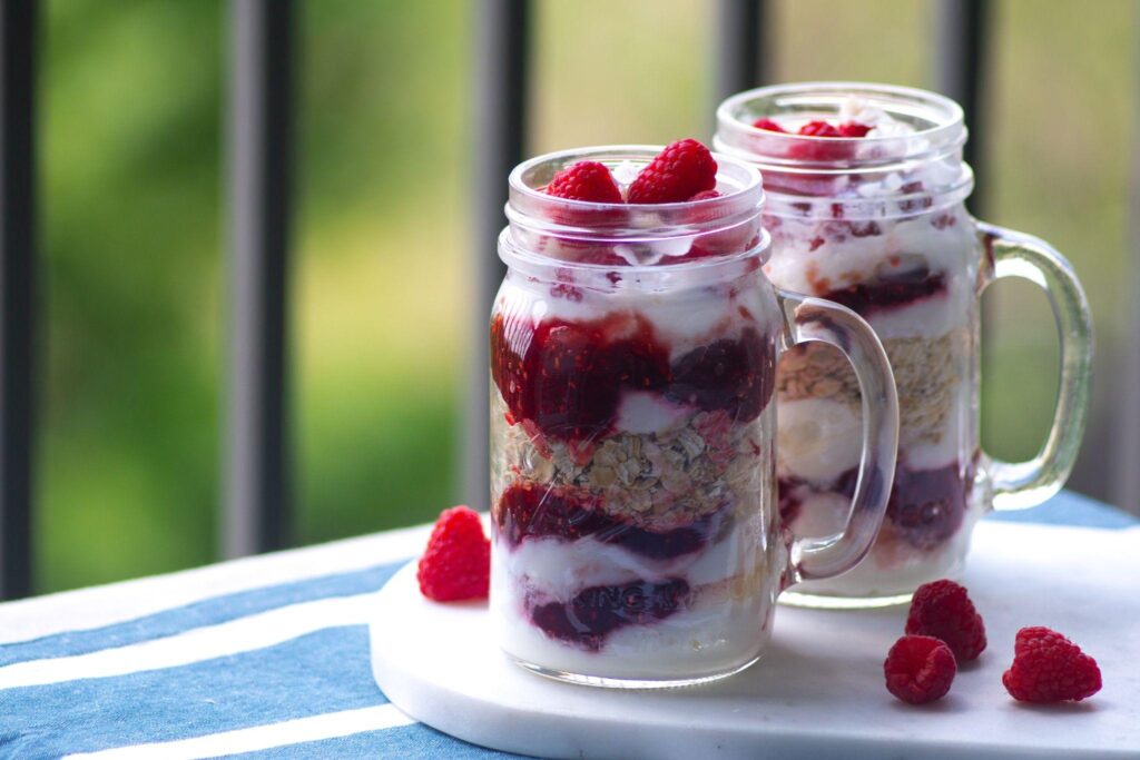 Overnight oats with raspberries in glass jar