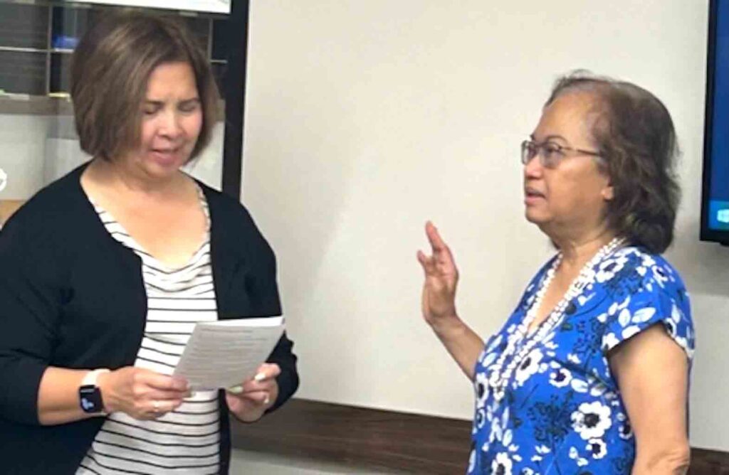 Lydia Pomposo (right) swears in before ALLICE 2023 co-president Flor Nicolas, Mayor of South San Francisco.  INQUIRER/CMQ Moreno