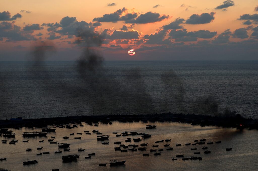 FILE PHOTO: Smoke rises after Israeli strikes on the seaport of Gaza City, in Gaza, October 10, 2023. REUTERS/Mohammed Salem/File Photo