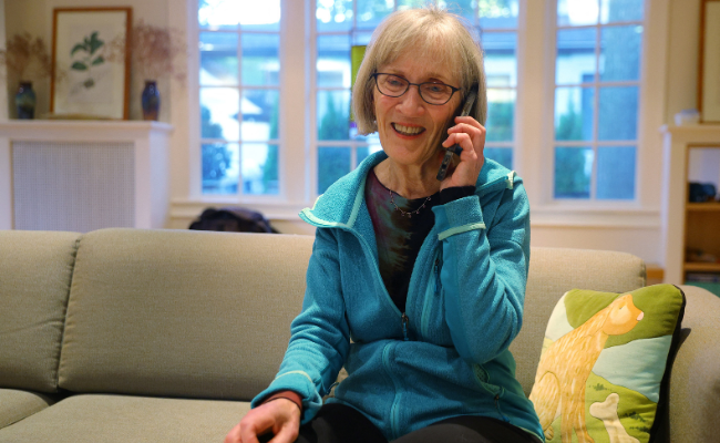 Harvard professor Claudia Goldin talks on the phone after winning the Nobel Prize for Economics at her home in Cambridge, Massachusetts, US | Photo by Brian Snyder/Reuters