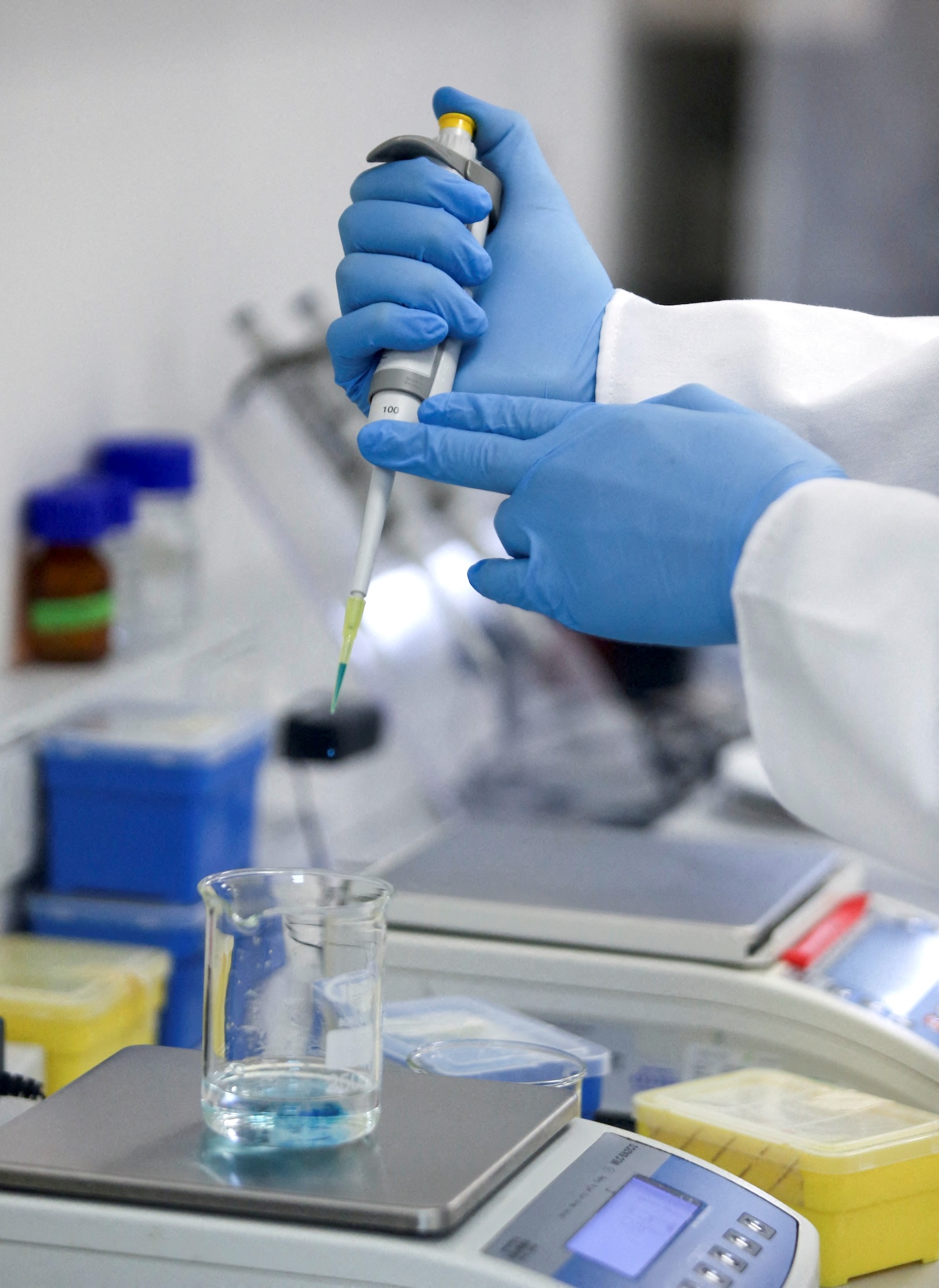 FILE PHOTO: A production scientist works with samples at a WHO-backed mRNA vaccine hub, in Cape Town, South Africa, February 11, 2022. REUTERS/Shelley Christians/File Photo