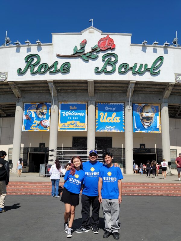 Philippine Independence Day Foundation president Fred Docdocil with daughter Faith Anne and son Jedrick Alain at the Rose Bowl