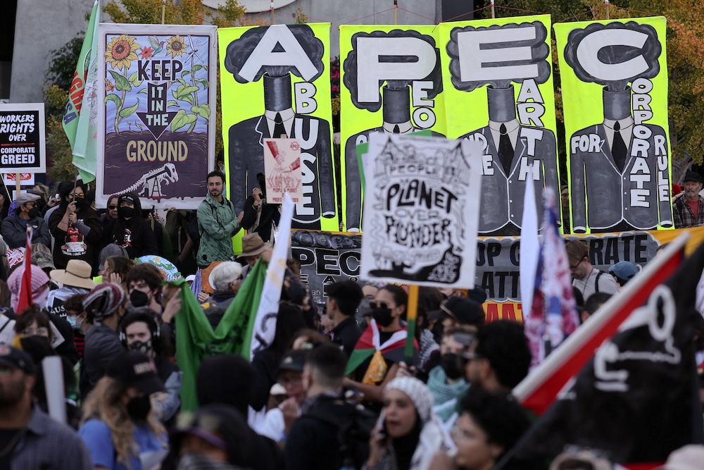 People attend a protest against the upcoming APEC Summit on Nov. 12, 2023 | Photo by Carlos Barria/Reuters